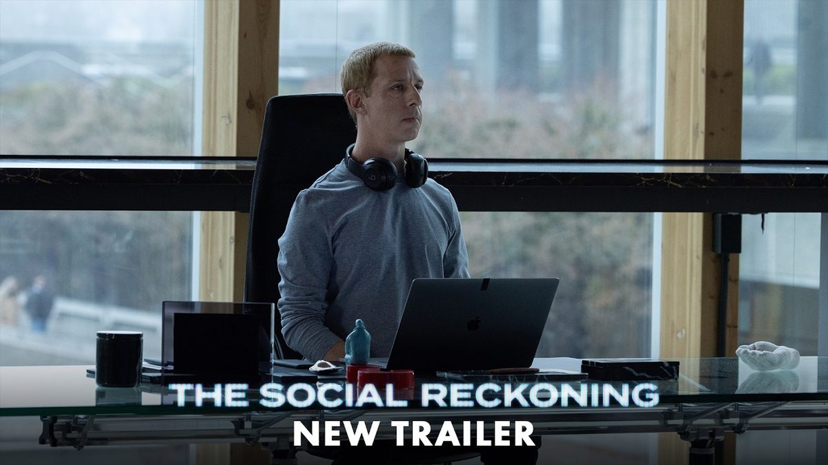 Jeremy Strong as Mark Zuckerberg at a glass desk in the official trailer for The Social Reckoning
