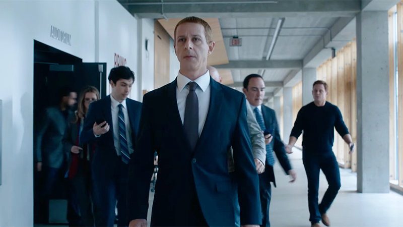 Jeremy Strong as Mark Zuckerberg walking through an office hallway in The Social Reckoning